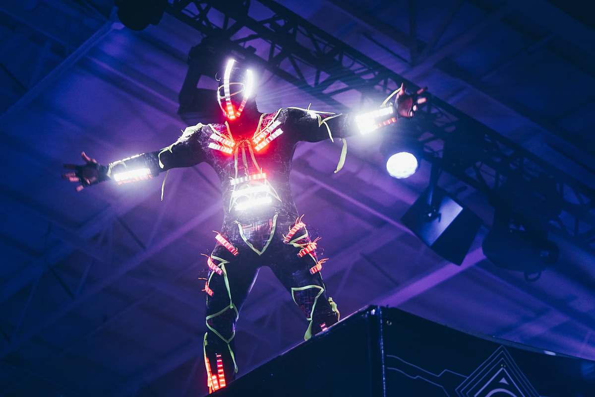 united states person wearing white and red LED light suit dance